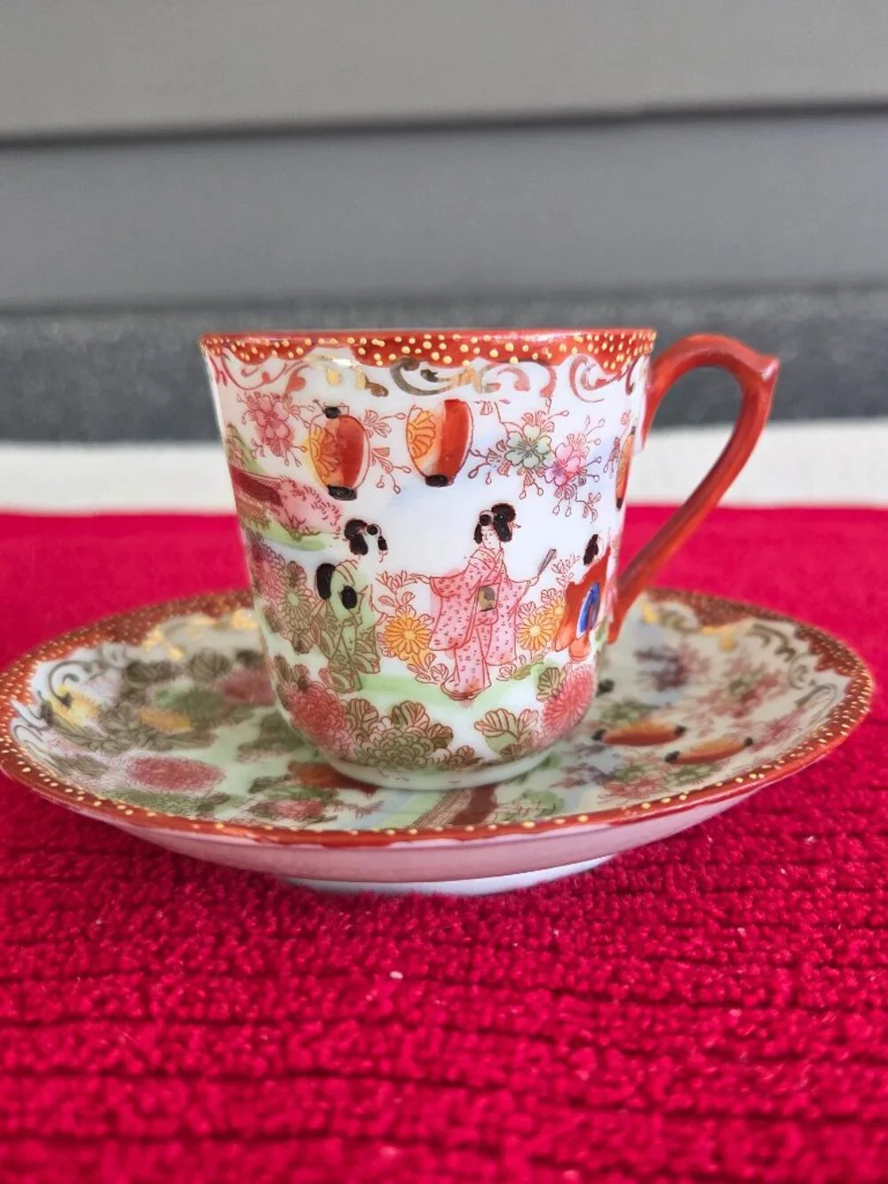 Japanese hand painted porcelain demitasse cup and saucer Geisha garden gilt trim